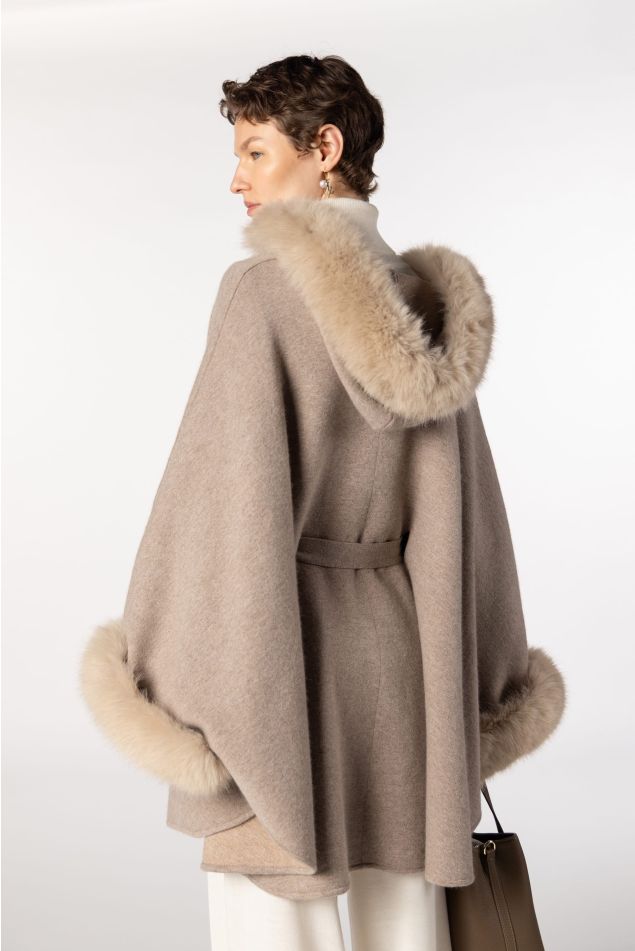 Cape-style knit coat with faux fur collar